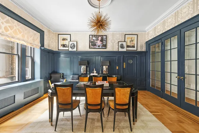 a view of a hallway with seating area