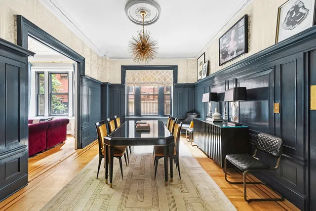a dining room with furniture and window