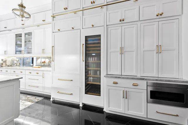 a kitchen with stainless steel appliances granite countertop a stove and a sink