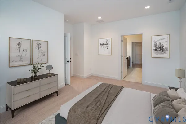 a spacious bedroom with a bed and a chandelier