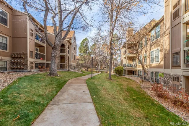 a view of a building with a yard