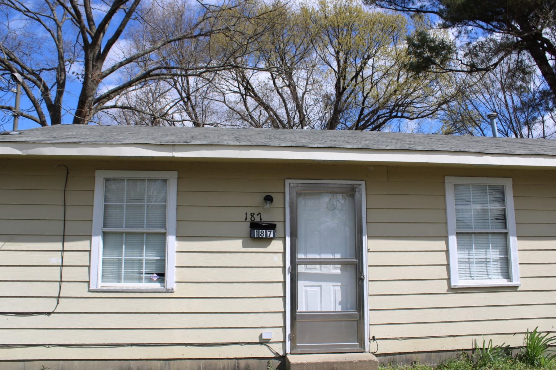 187 Land Avenue Ripley, TN 38063 - Photo 2 of 22 a small white house with a outdoor space