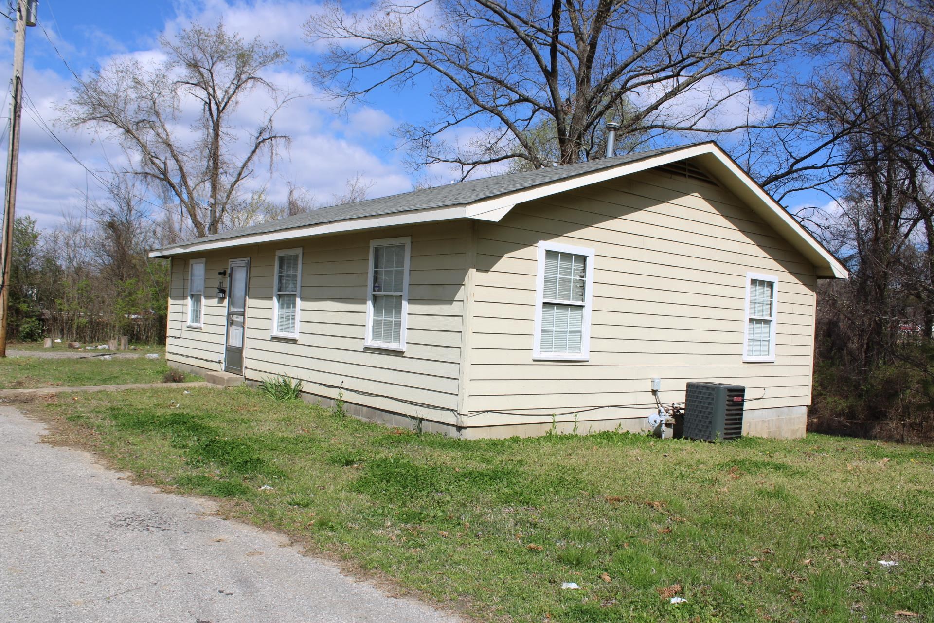 187 Land Avenue Ripley, TN 38063 - Photo 22 of 22 a front view of a house with a garden