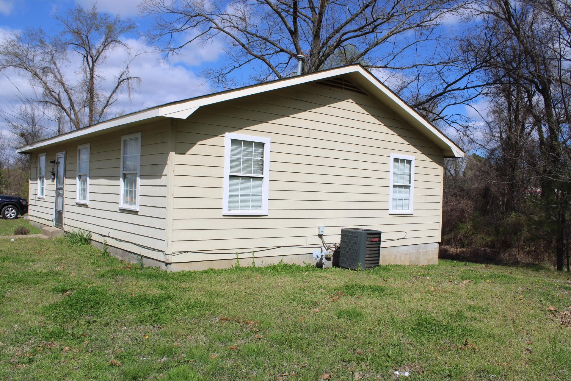 187 Land Avenue Ripley, TN 38063 - Photo 4 of 22 a front view of house with a garden