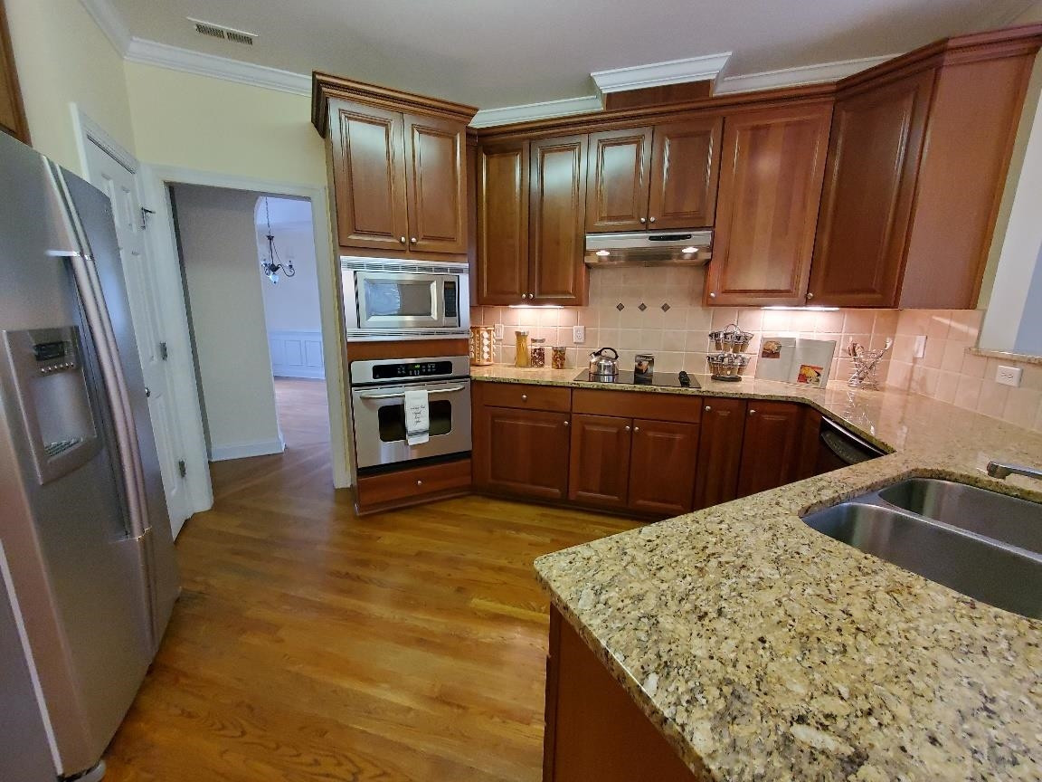 263 Waterville Street Raleigh, NC 27603 - Photo 4 of 23 Stainless Steel Appliances. Wall Oven & Microwave Plus Dishwasher and Cook Top with Vent and Double Sink. Kitchen Refrigerator Conveys. Also Offers Under Cabinet Lighting and Coffee Bar Counter Top (not pictured) to the right of Refrigerator. Chef's Kitchen