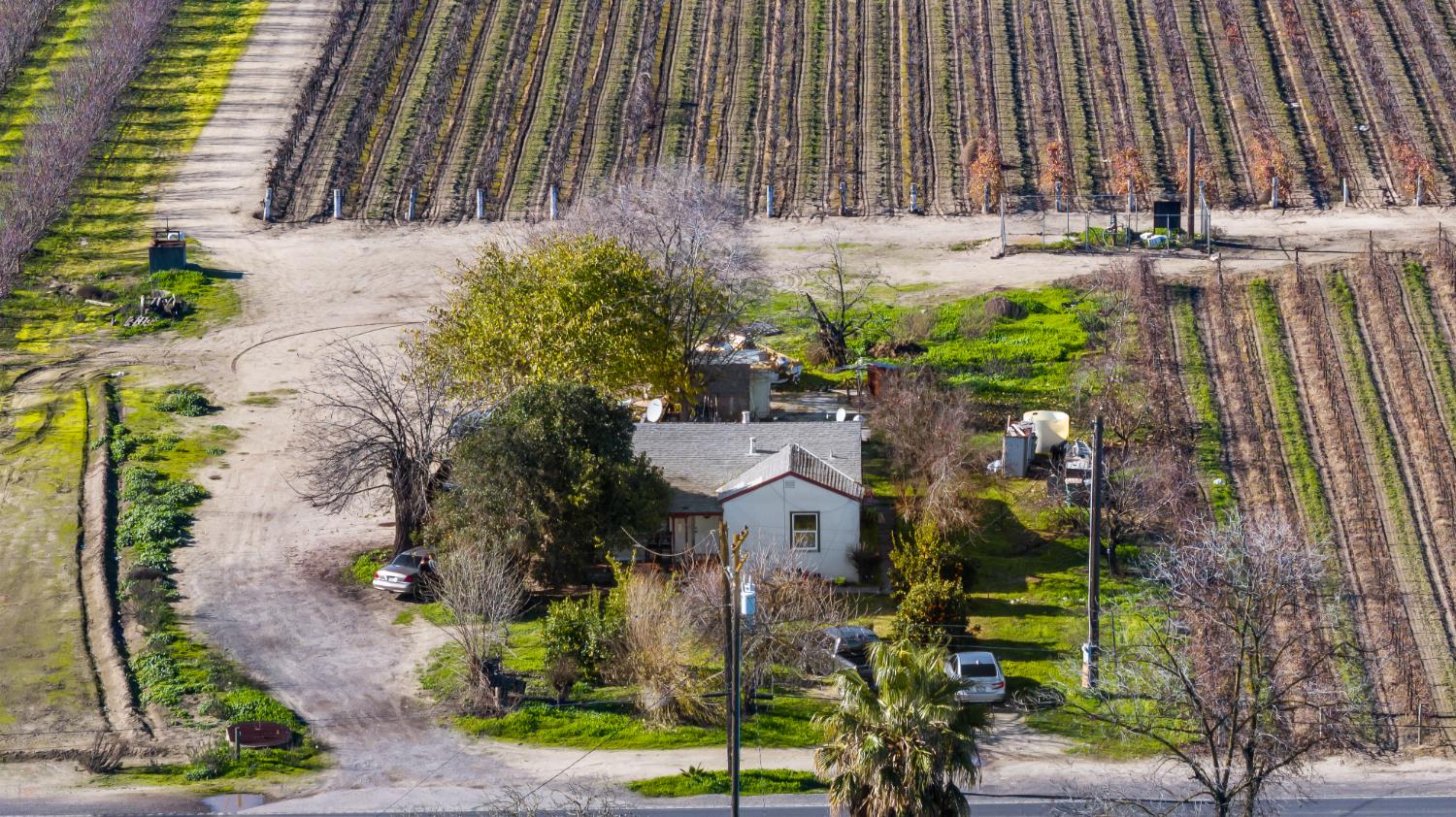 11385 South Union Road Manteca, CA 95336 - Photo 9 of 15 a view of a house with a yard and potted plants