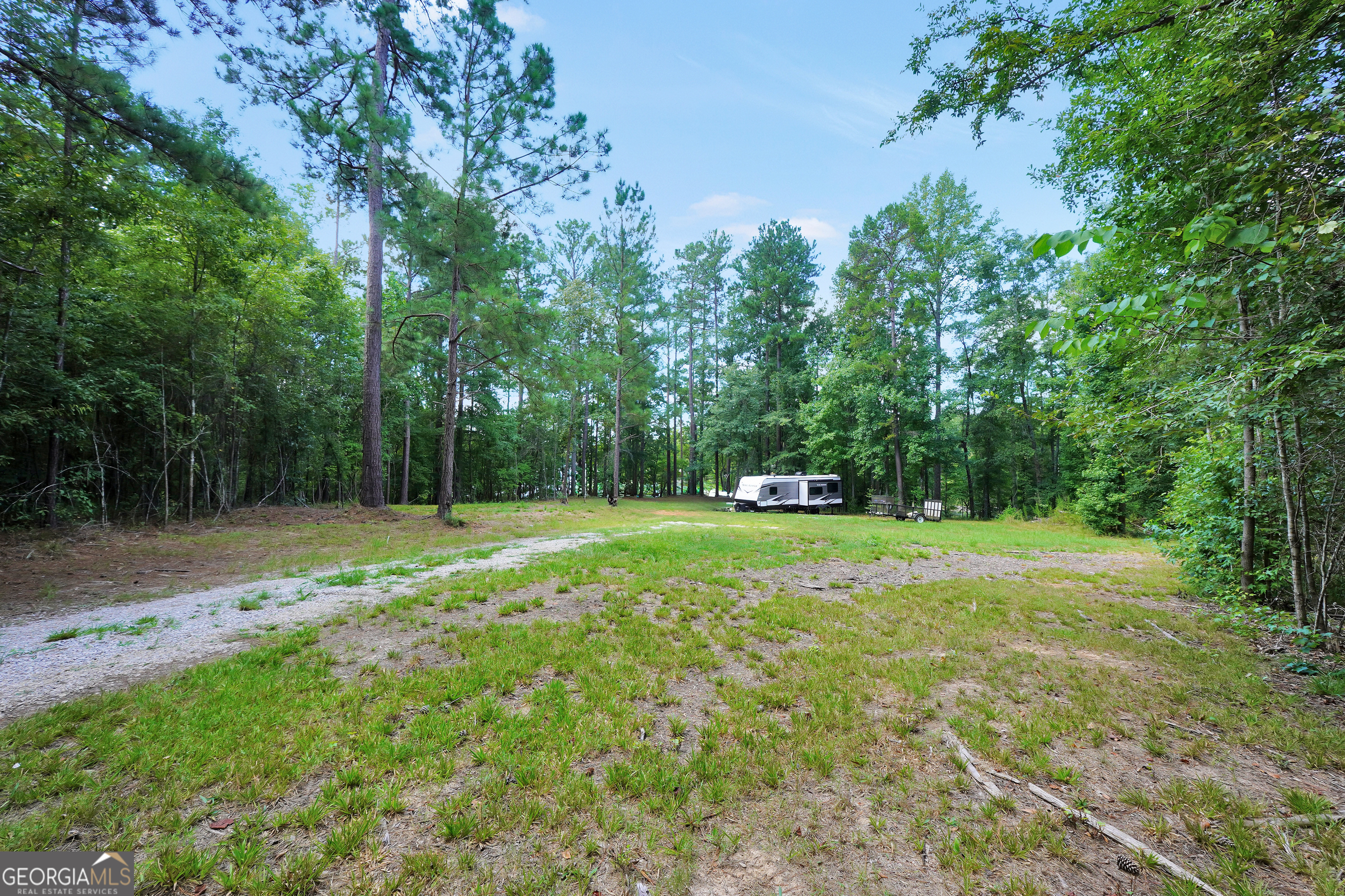 0 Scuffleboro Road Southeast Eatonton, GA 31024 - Photo 21 of 77 a view of a field with trees in the background
