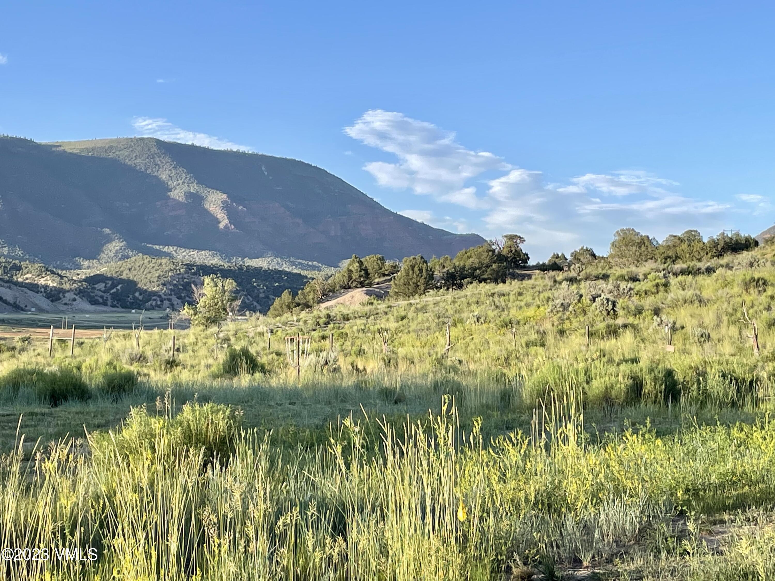 350 Bluffs Drive Eagle, CO 81631 - Photo 2 of 5 a view of a lake with a mountain in the background