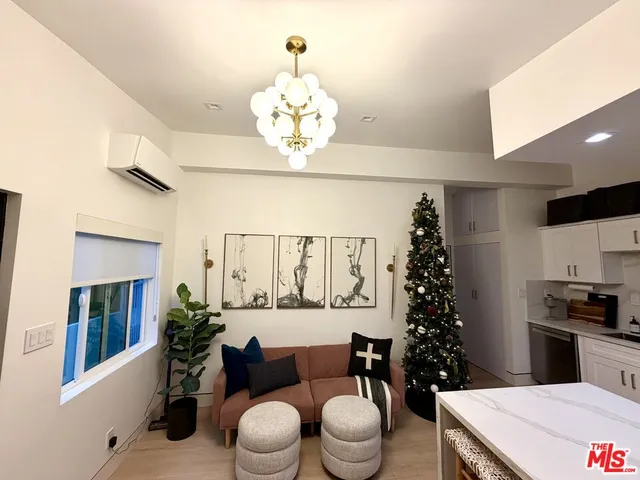 a bathroom with a granite countertop sink a toilet and a mirror