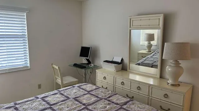 a bedroom with a bed and furniture