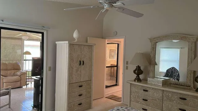 a en suite bathroom with a shower sink and mirror