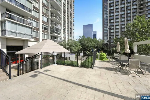 a view of a building with sitting area