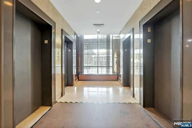 a view of entryway with a floor to ceiling window