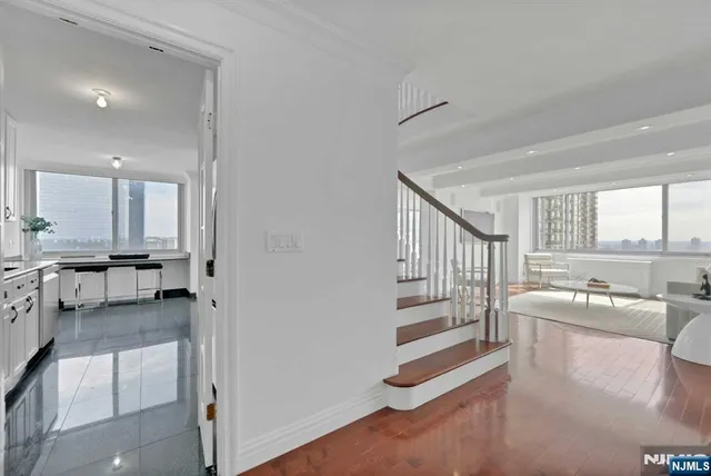 a living room with furniture and a table