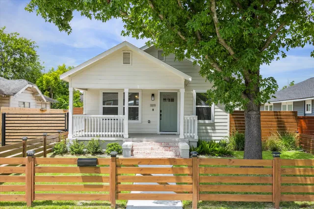 a front view of a house with garage