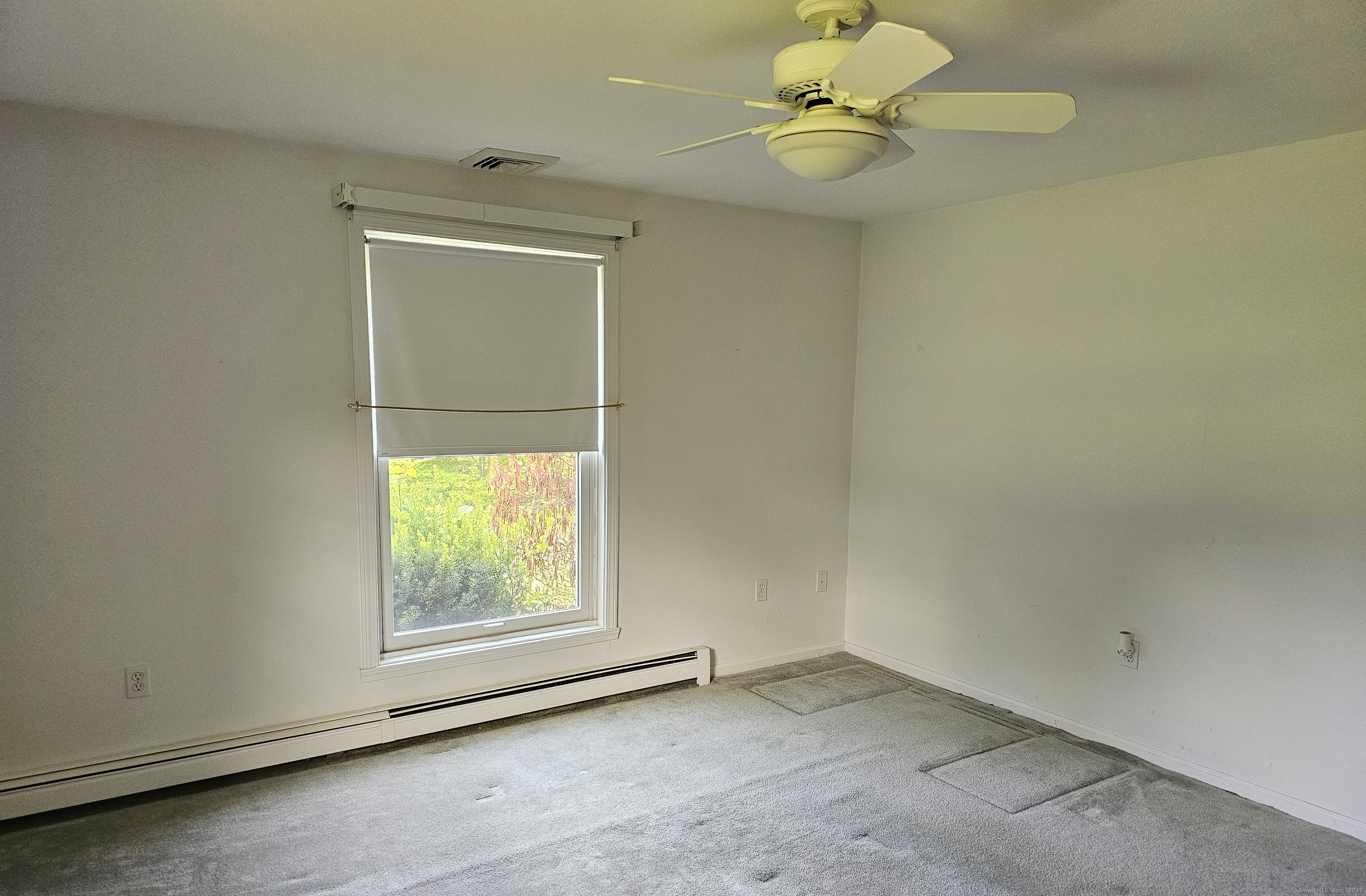 105 Minortown Road Woodbury, CT 06798 - Photo 19 of 35 an empty room with a window and a fan