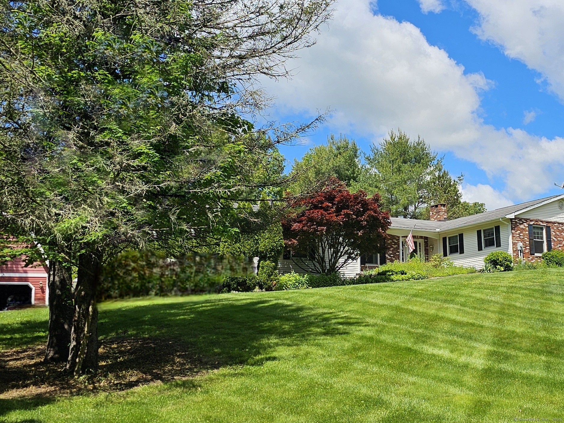 105 Minortown Road Woodbury, CT 06798 - Photo 2 of 35 a front view of a house with garden