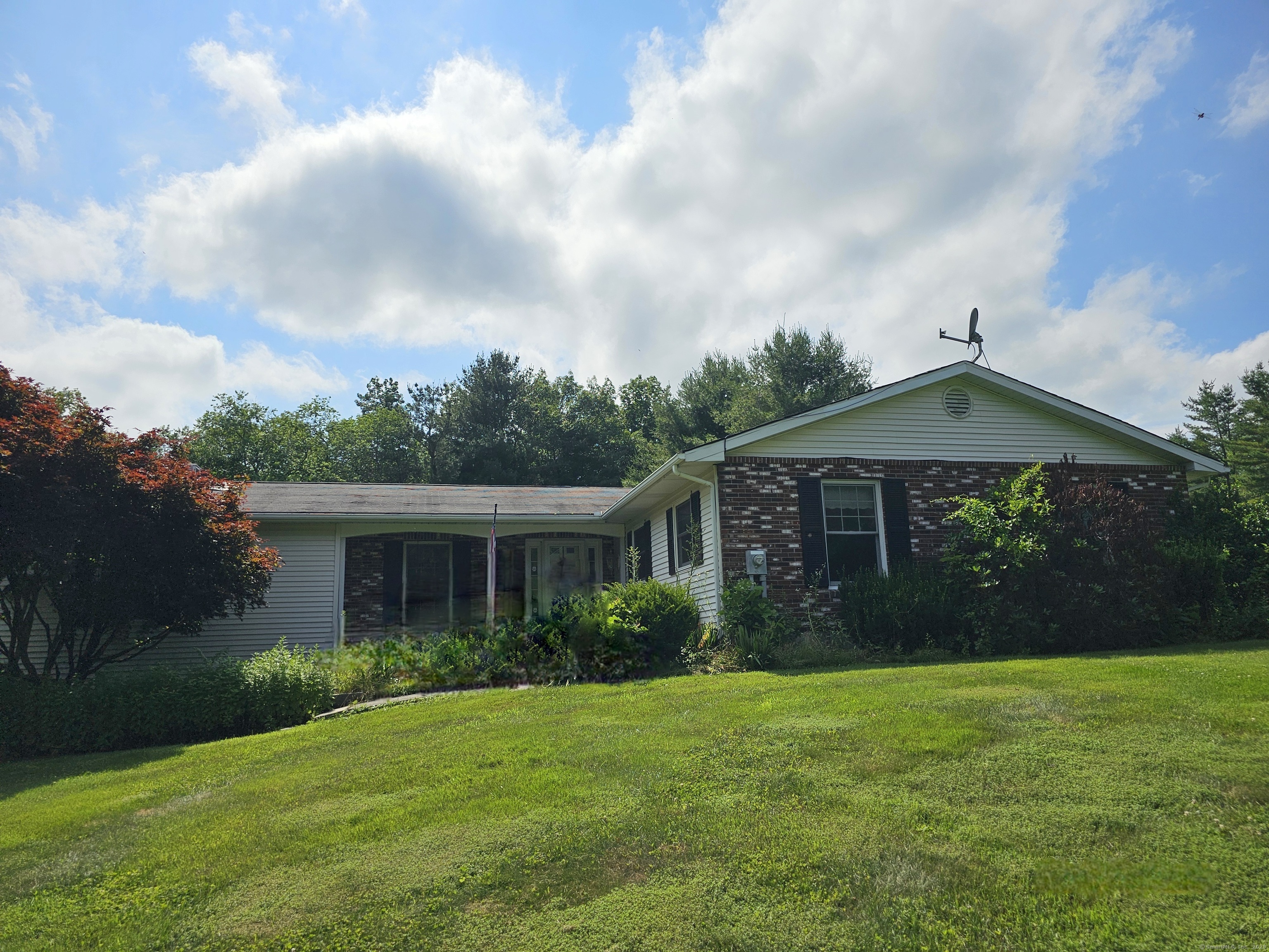 105 Minortown Road Woodbury, CT 06798 - Photo 3 of 35 a front view of house with yard and green space