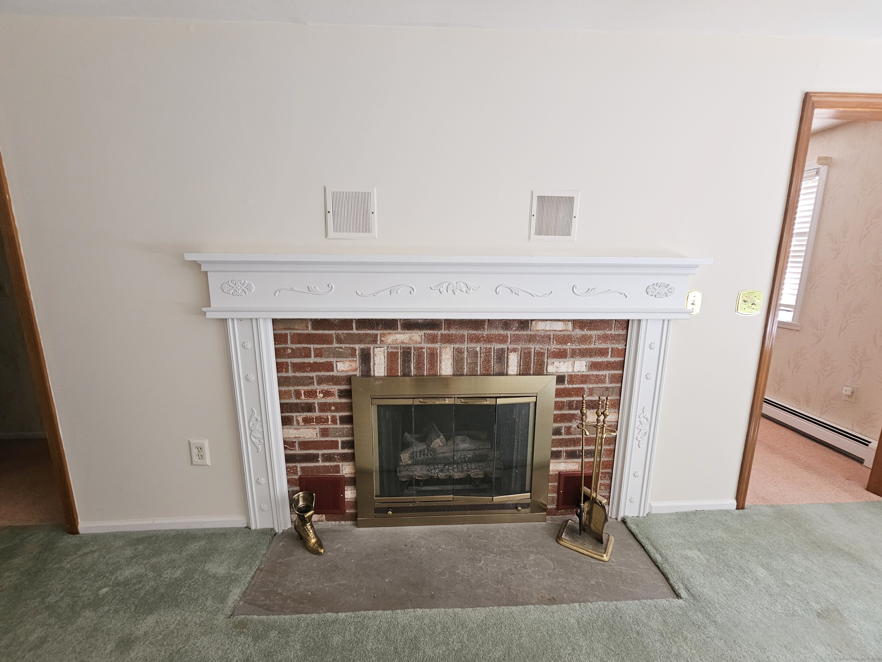 105 Minortown Road Woodbury, CT 06798 - Photo 10 of 35 a living room with a fireplace