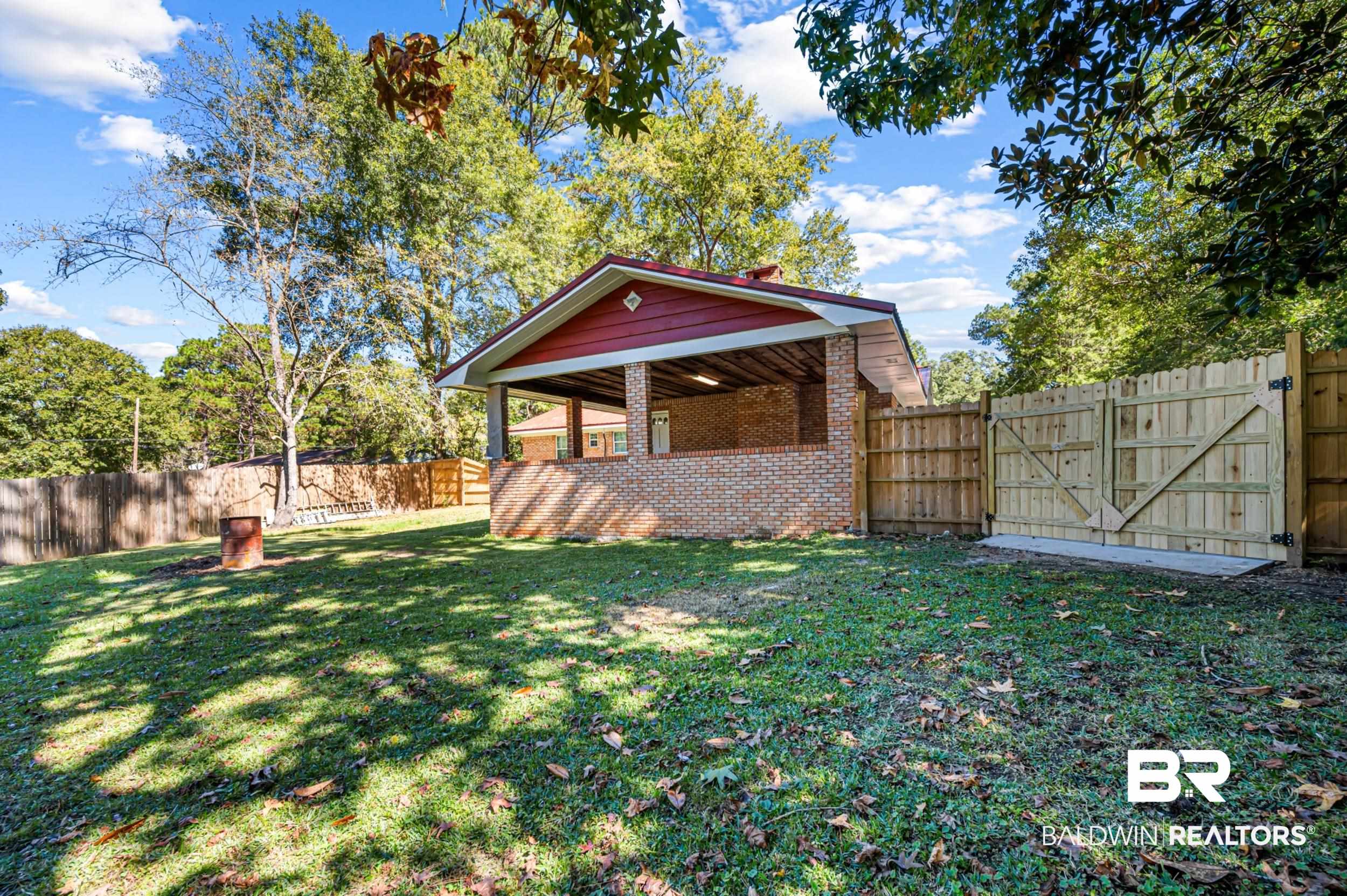 1605 Collier Avenue Bay Minette, AL 36507 - Photo 33 of 36 Fenced backyard featuring a gate