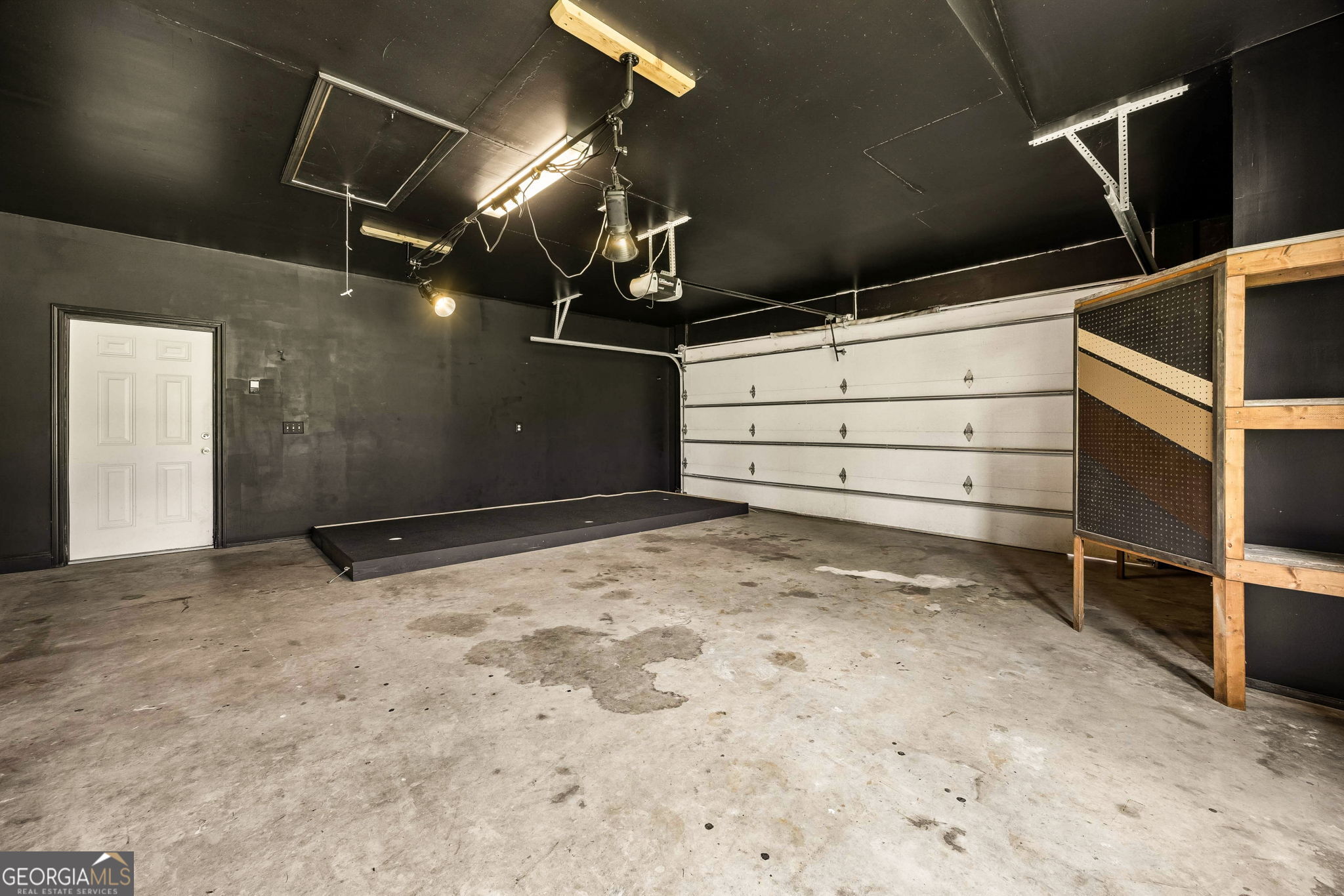 706 Hopewell Point Road White Oak, GA 31568 - Photo 81 of 84 Expansive garage offering room for vehicles, storage, hobbies, or workshop use.