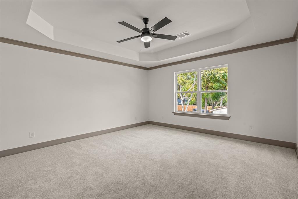 5720 Randolph Court Westworth Village, TX 76114 - Photo 25 of 40 an empty room with ceiling fan and window