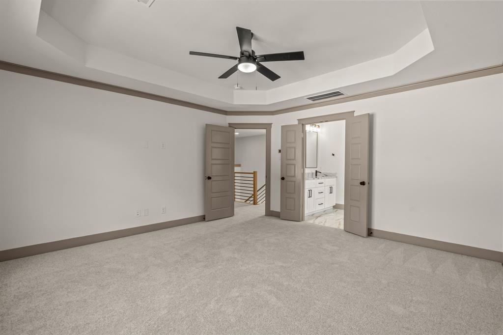 5720 Randolph Court Westworth Village, TX 76114 - Photo 26 of 40 a view of an empty room and a ceiling fan