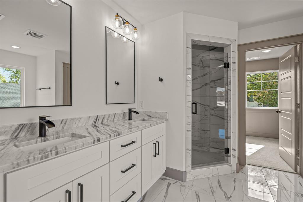 5720 Randolph Court Westworth Village, TX 76114 - Photo 27 of 40 a bathroom with a shower sink and mirror