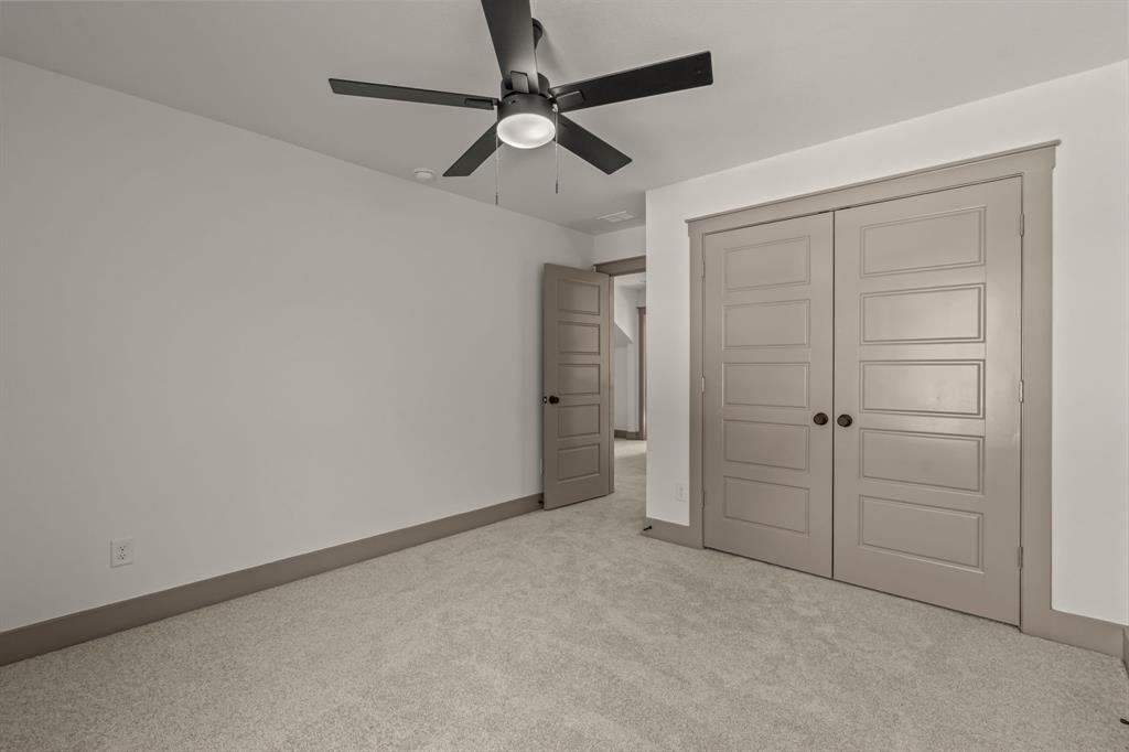 5720 Randolph Court Westworth Village, TX 76114 - Photo 32 of 40 en empty room with closet and a ceiling fan