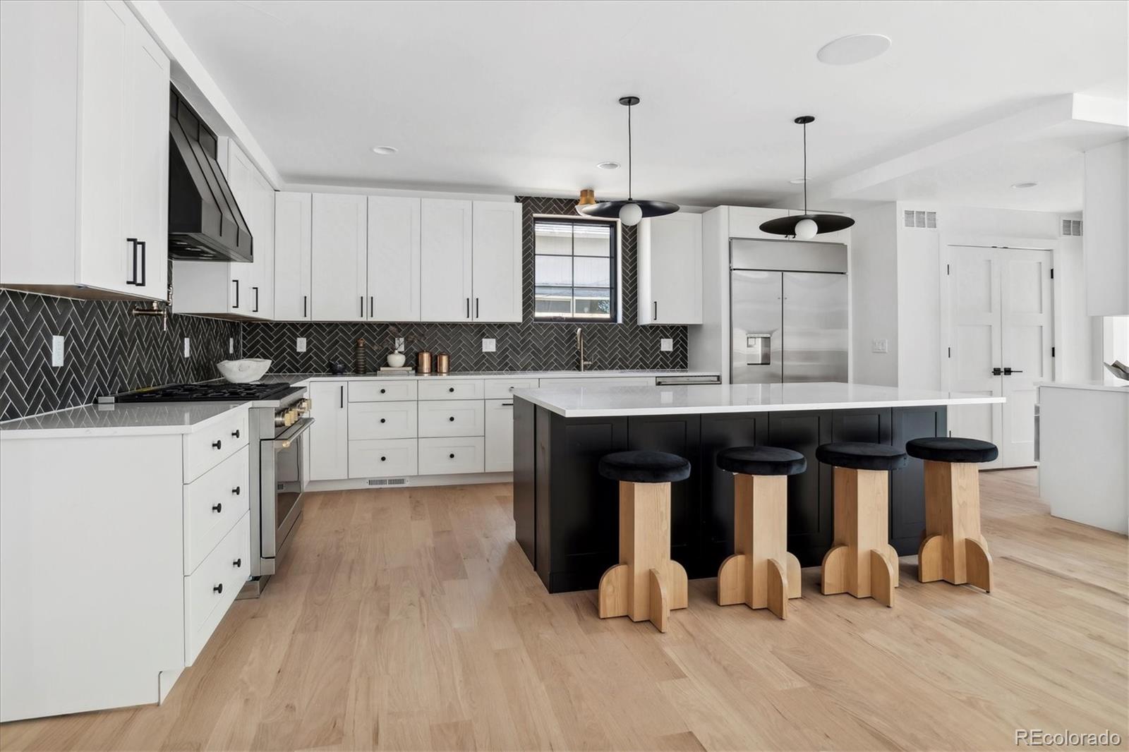2228 Lowell Boulevard Denver, CO 80211 - Photo 13 of 49 a kitchen with a sink appliances and cabinets