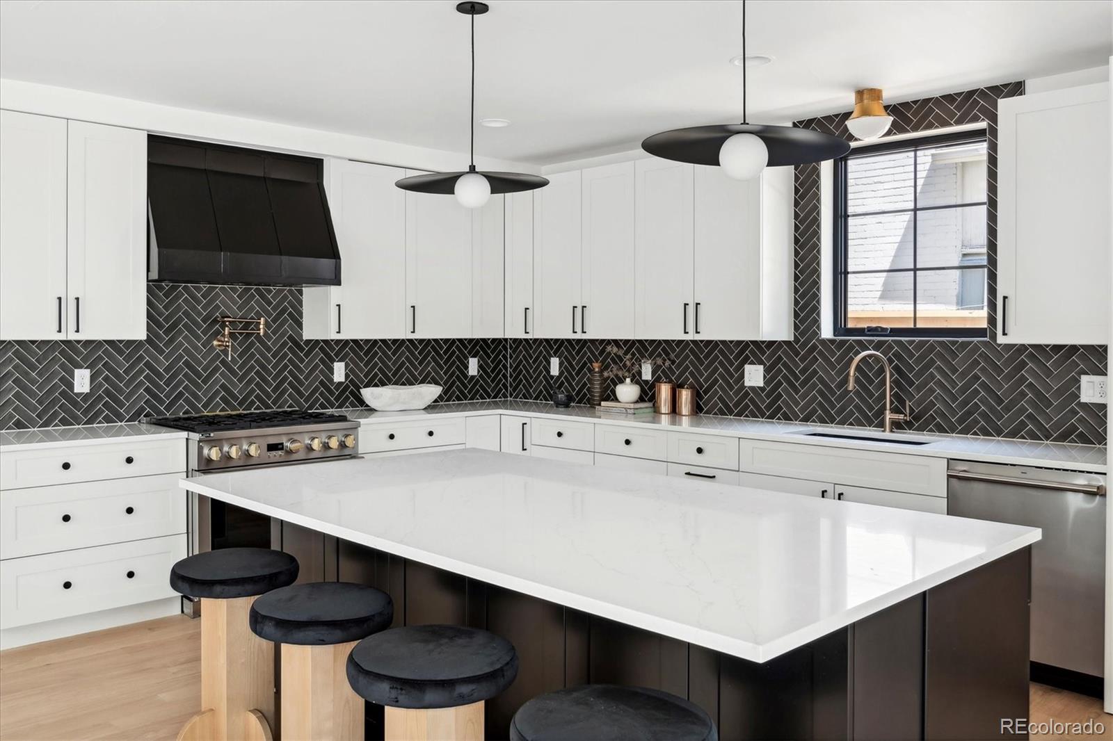 2228 Lowell Boulevard Denver, CO 80211 - Photo 15 of 49 a kitchen with a sink a stove and a refrigerator