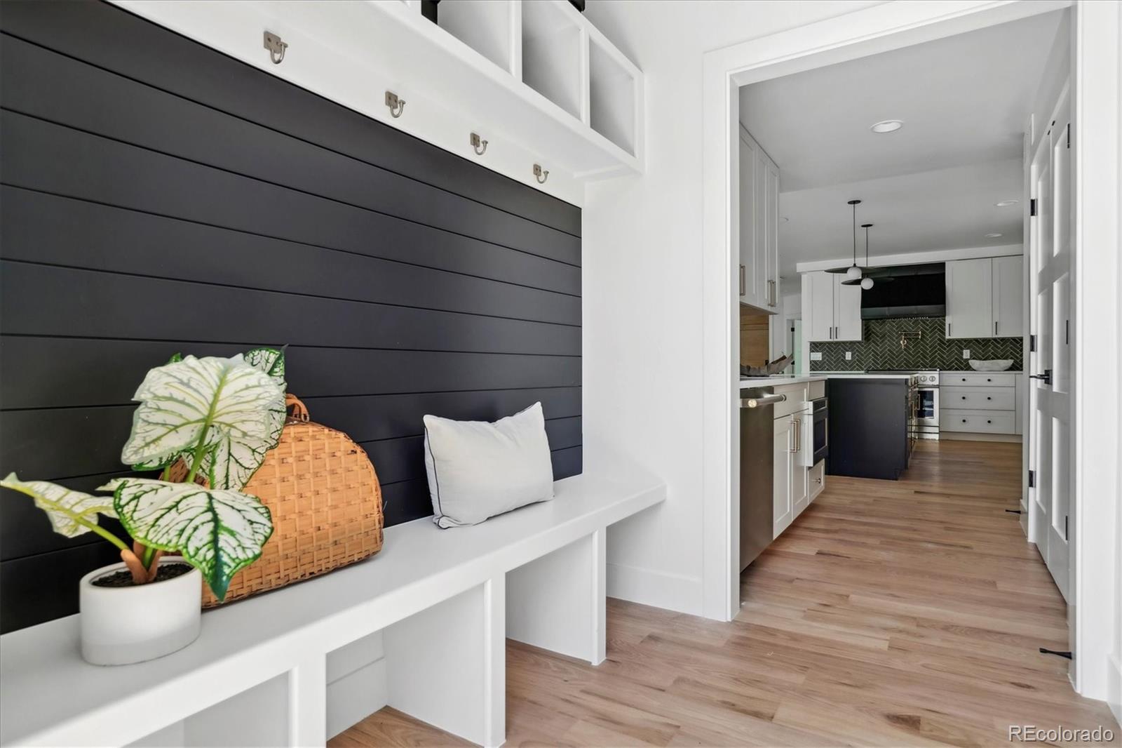 2228 Lowell Boulevard Denver, CO 80211 - Photo 21 of 49 a kitchen with a cabinets and appliances