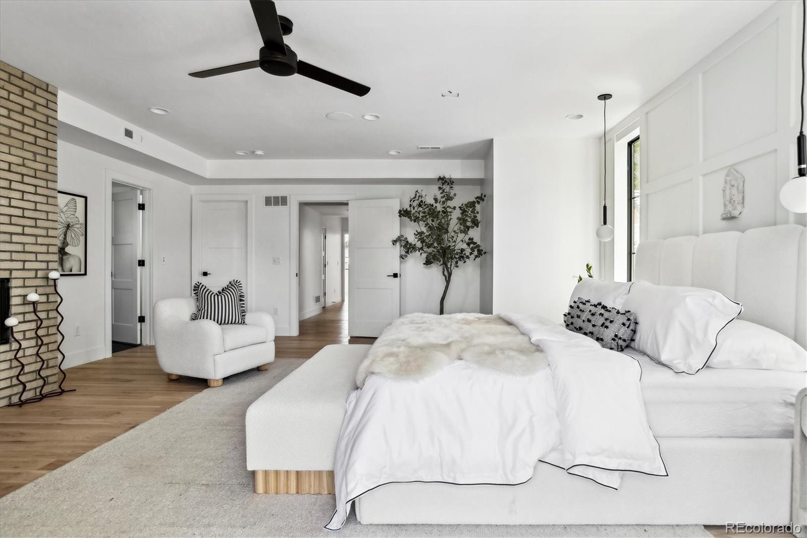 2228 Lowell Boulevard Denver, CO 80211 - Photo 25 of 49 a bedroom with a bed and couch