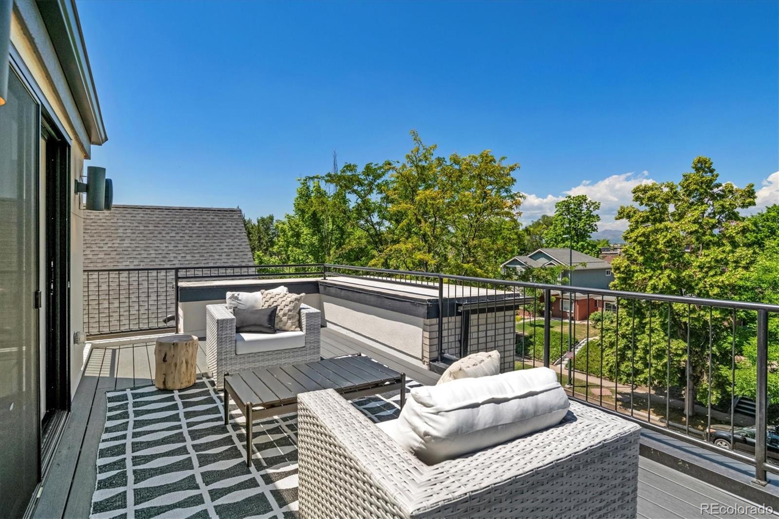 2228 Lowell Boulevard Denver, CO 80211 - Photo 3 of 49 a view of balcony with wooden floor and seating space