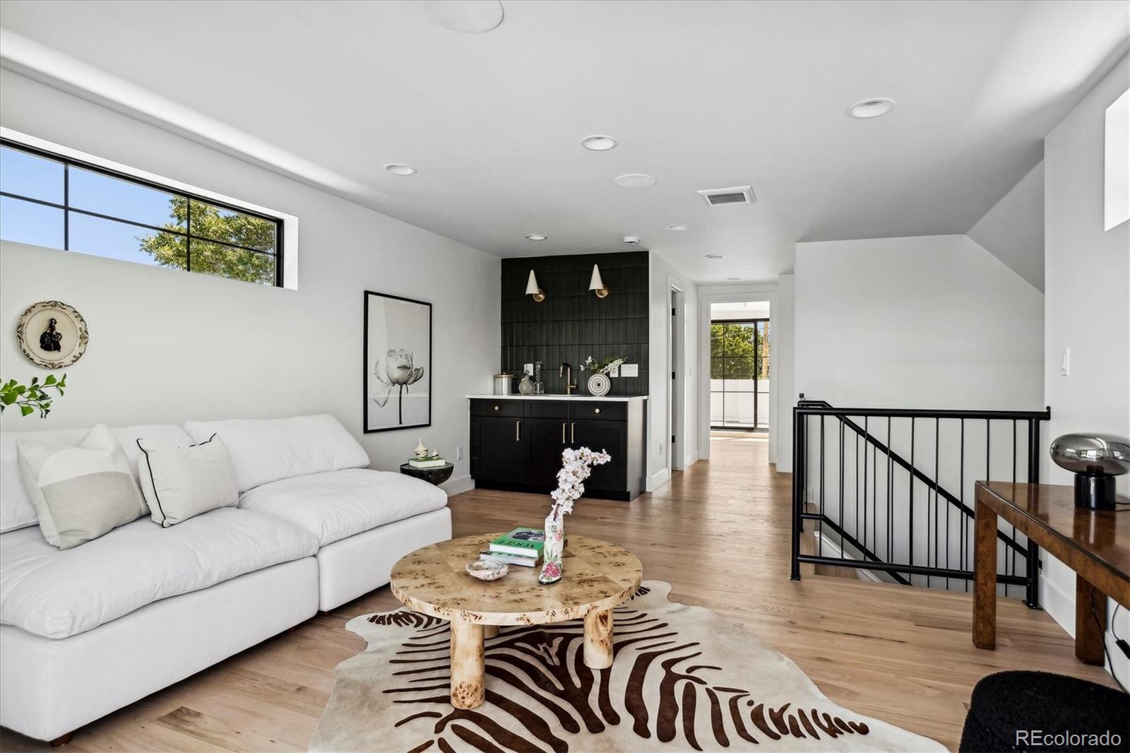 2228 Lowell Boulevard Denver, CO 80211 - Photo 35 of 49 a living room with furniture and wooden floor