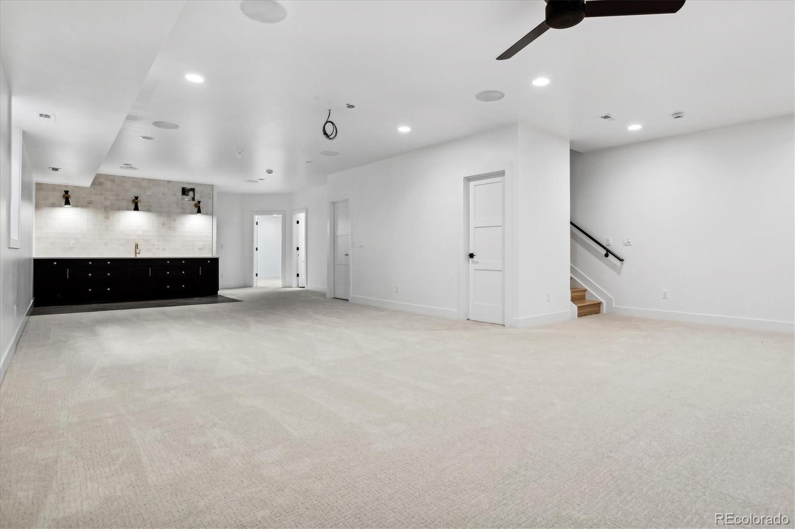 2228 Lowell Boulevard Denver, CO 80211 - Photo 42 of 49 a large room with a large bed and a large window