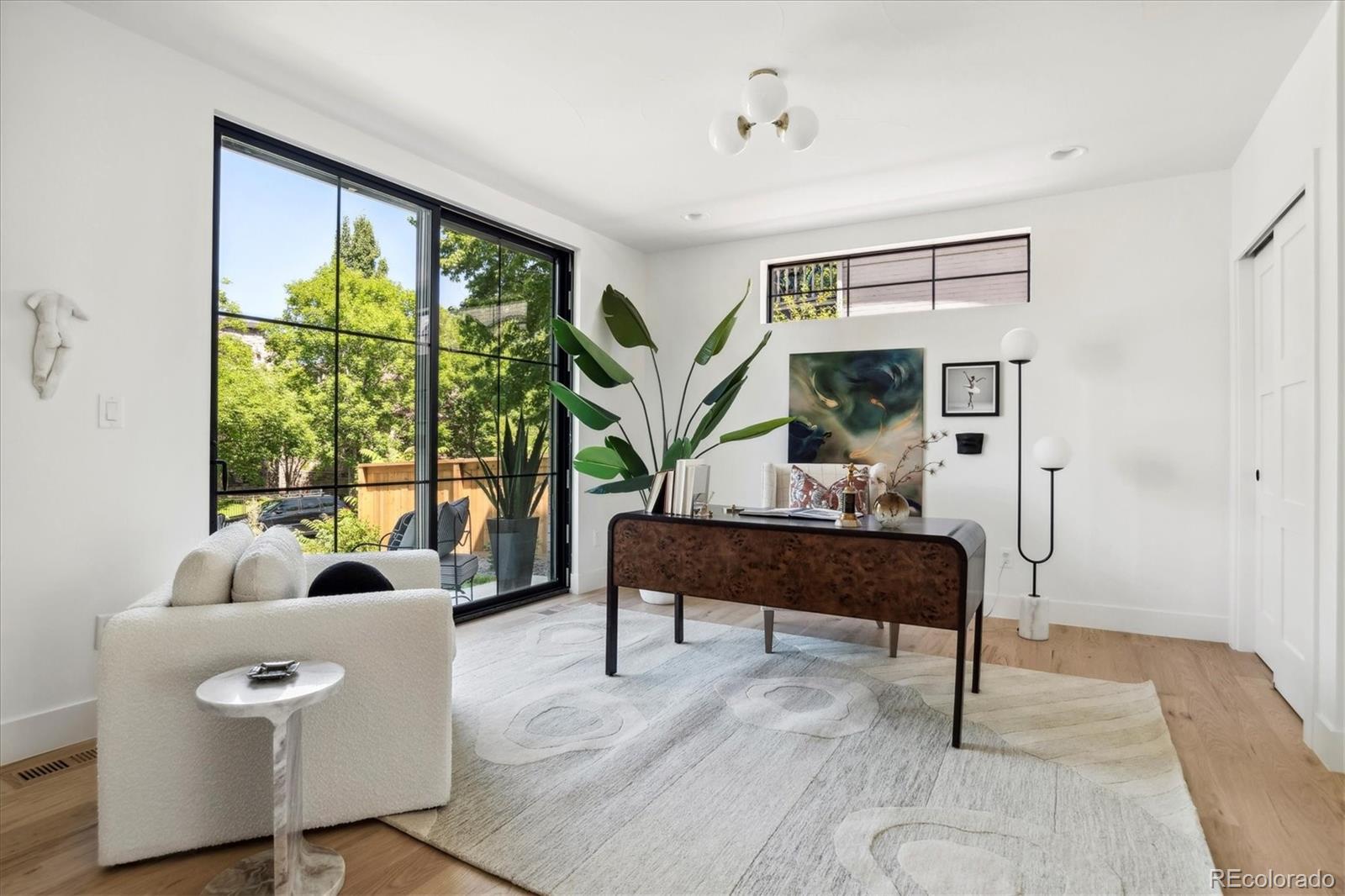 2228 Lowell Boulevard Denver, CO 80211 - Photo 10 of 49 a living room with furniture and a large window