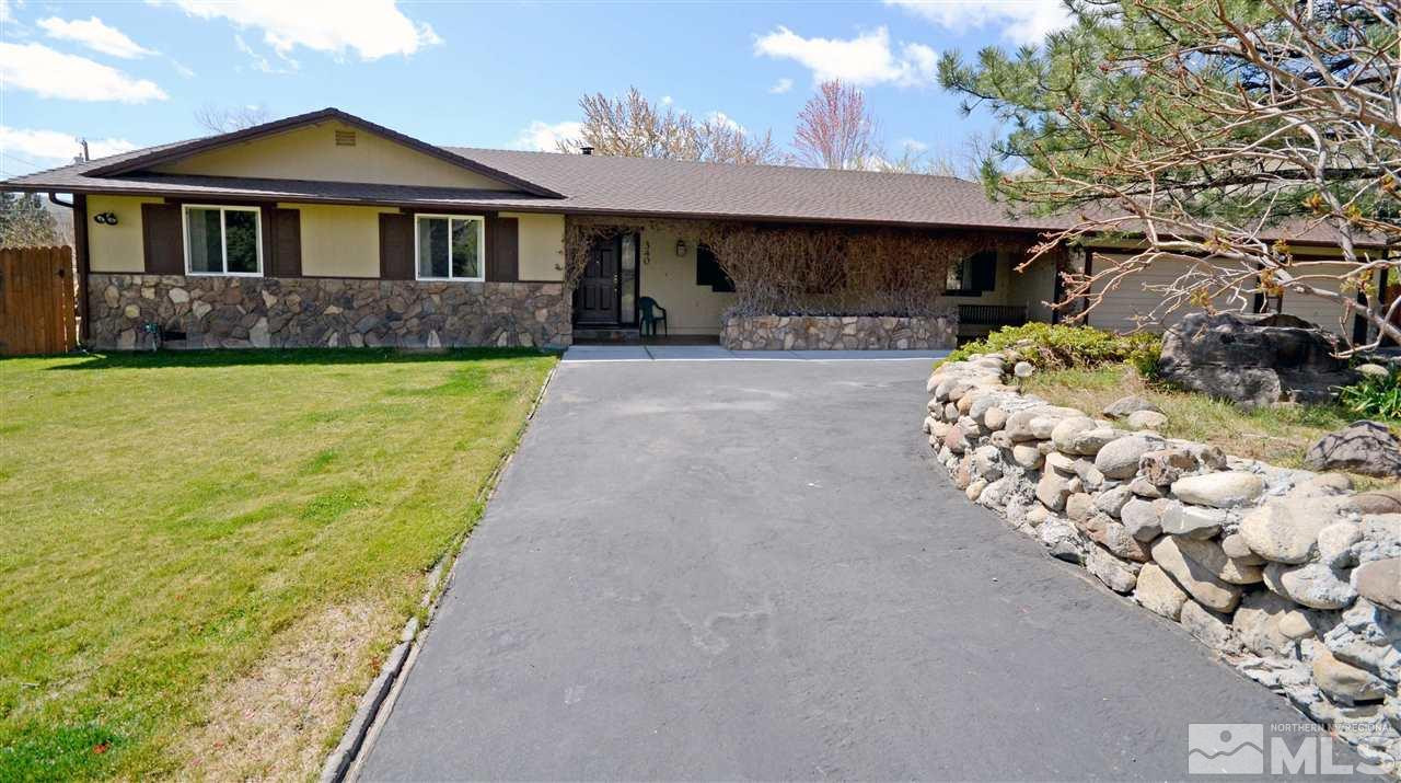 340 Galena Pines Road Reno, NV 89521 - Photo 1 of 1 a front view of a house with a yard and garage