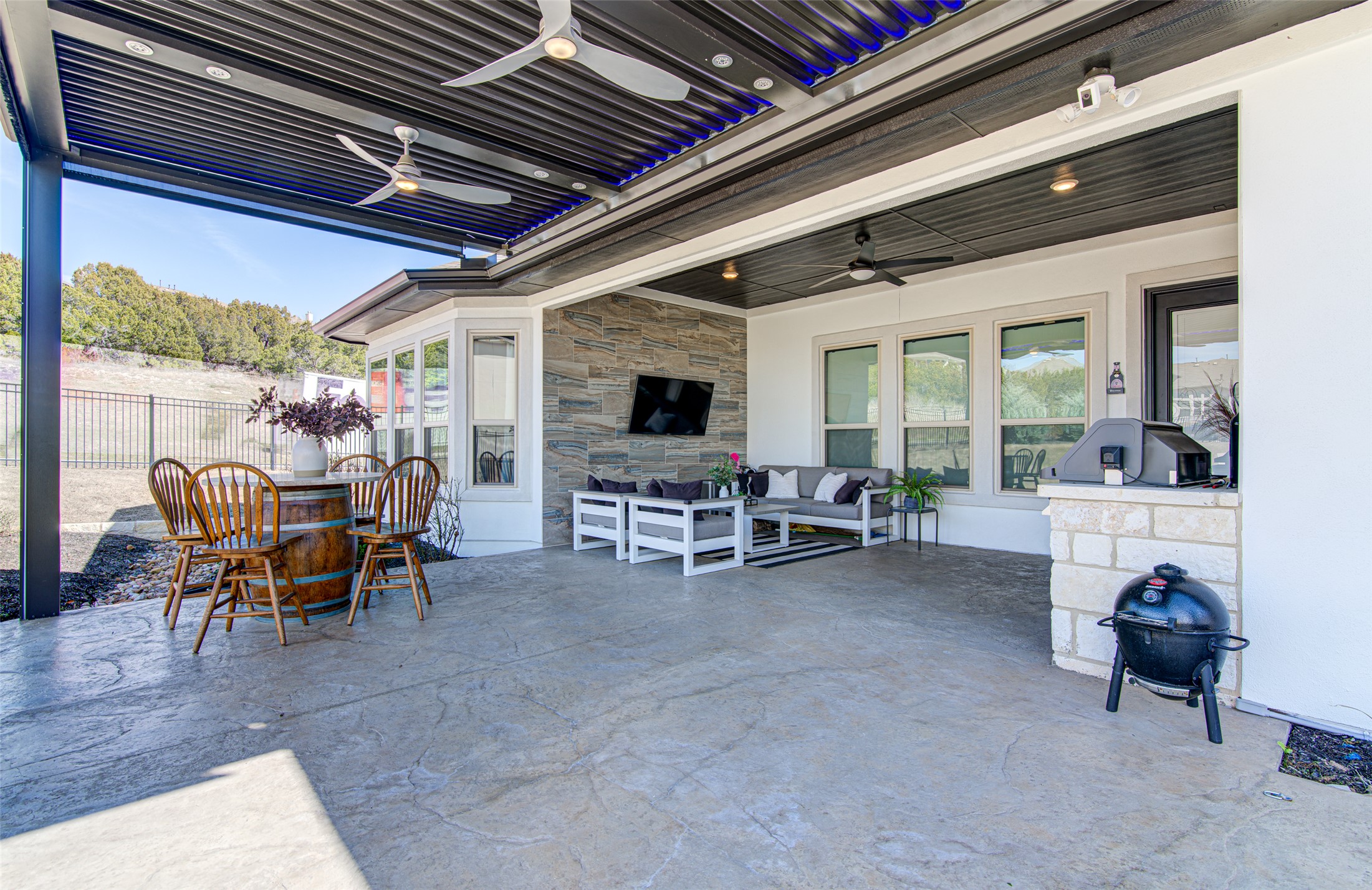 4309 Olive Grv Cove Leander, TX 78641 - Photo 21 of 27 View of patio / terrace with ceiling fan, an outdoor fireplace, outdoor lounge area, and area for grilling