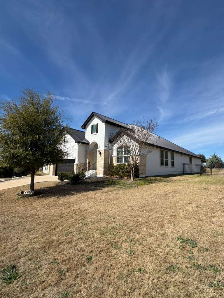 4309 Olive Grv Cove Leander, TX 78641 - Photo 27 of 27 View of front of house featuring stucco siding and a front yard