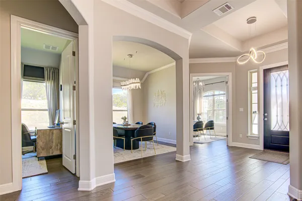 a view of a livingroom with furniture and wooden floor