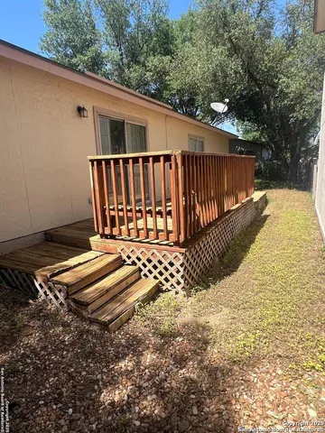 a view of a backyard with a fence