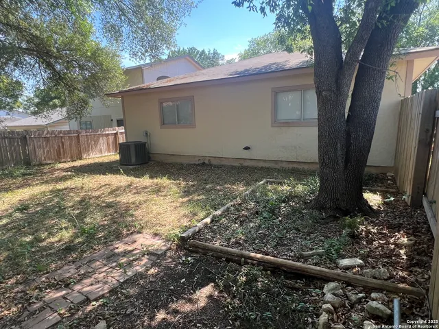 a view of a backyard of the house