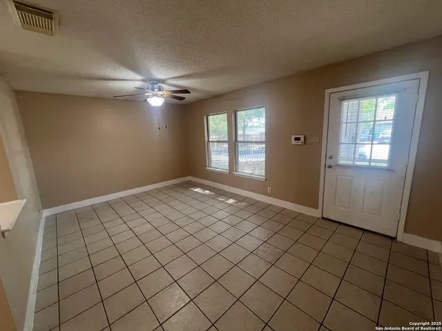 a view of an empty room and window