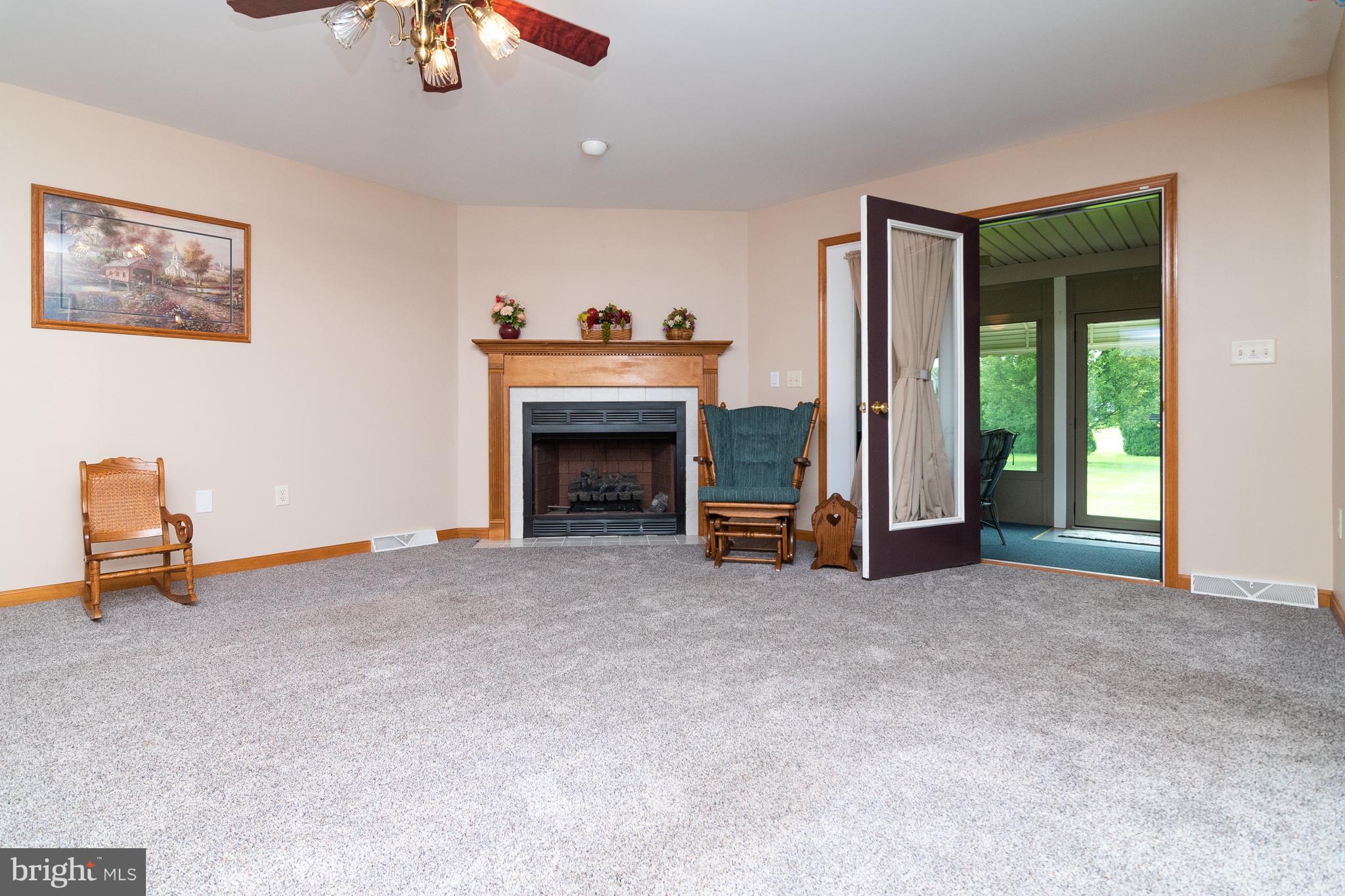 125 Debs Way Dover, DE 19901 - Photo 7 of 31 Living room leading to the sunroom