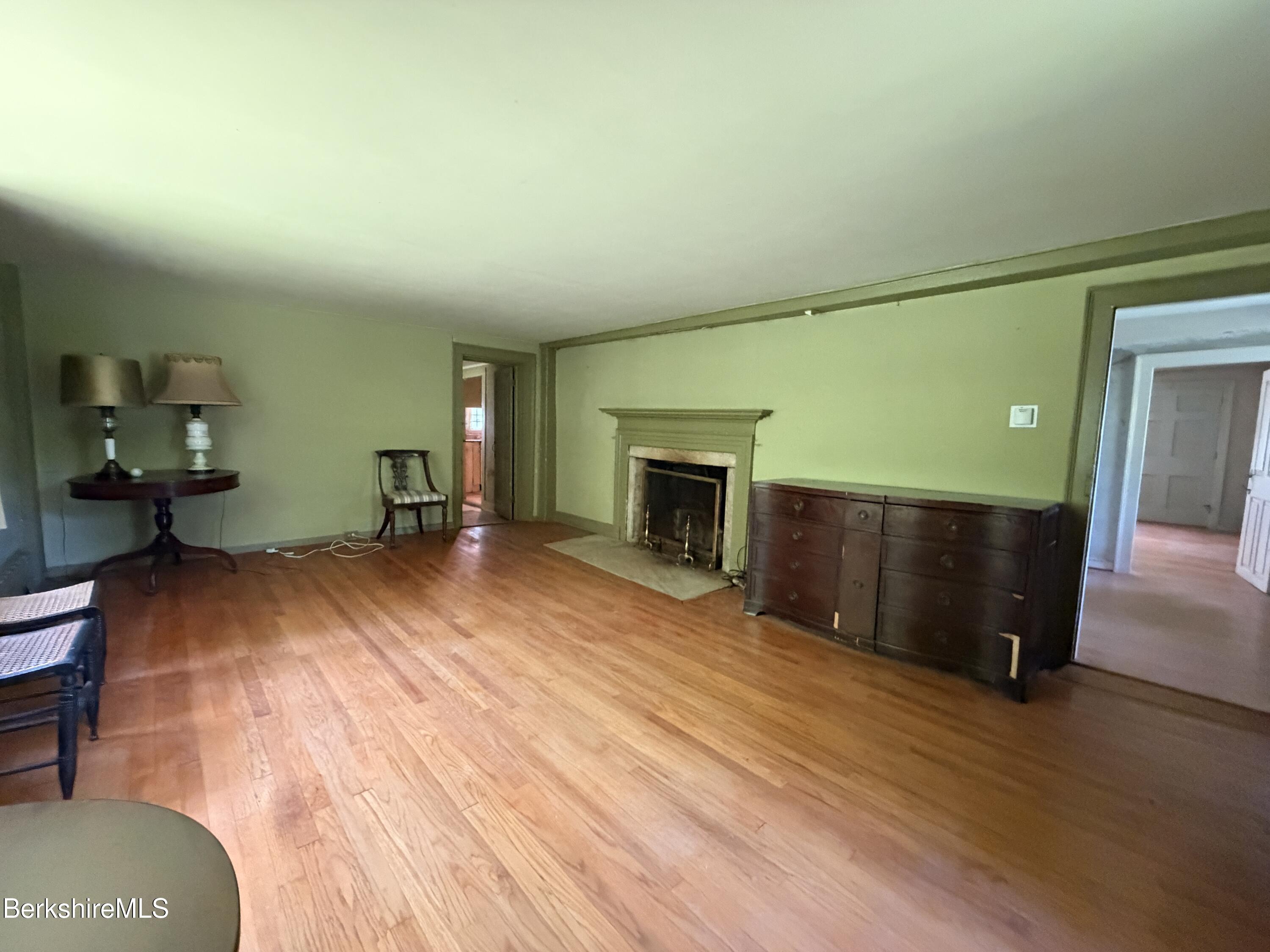 254 Main Street Sheffield, MA 01257 - Photo 8 of 13 a living room with furniture and a fireplace