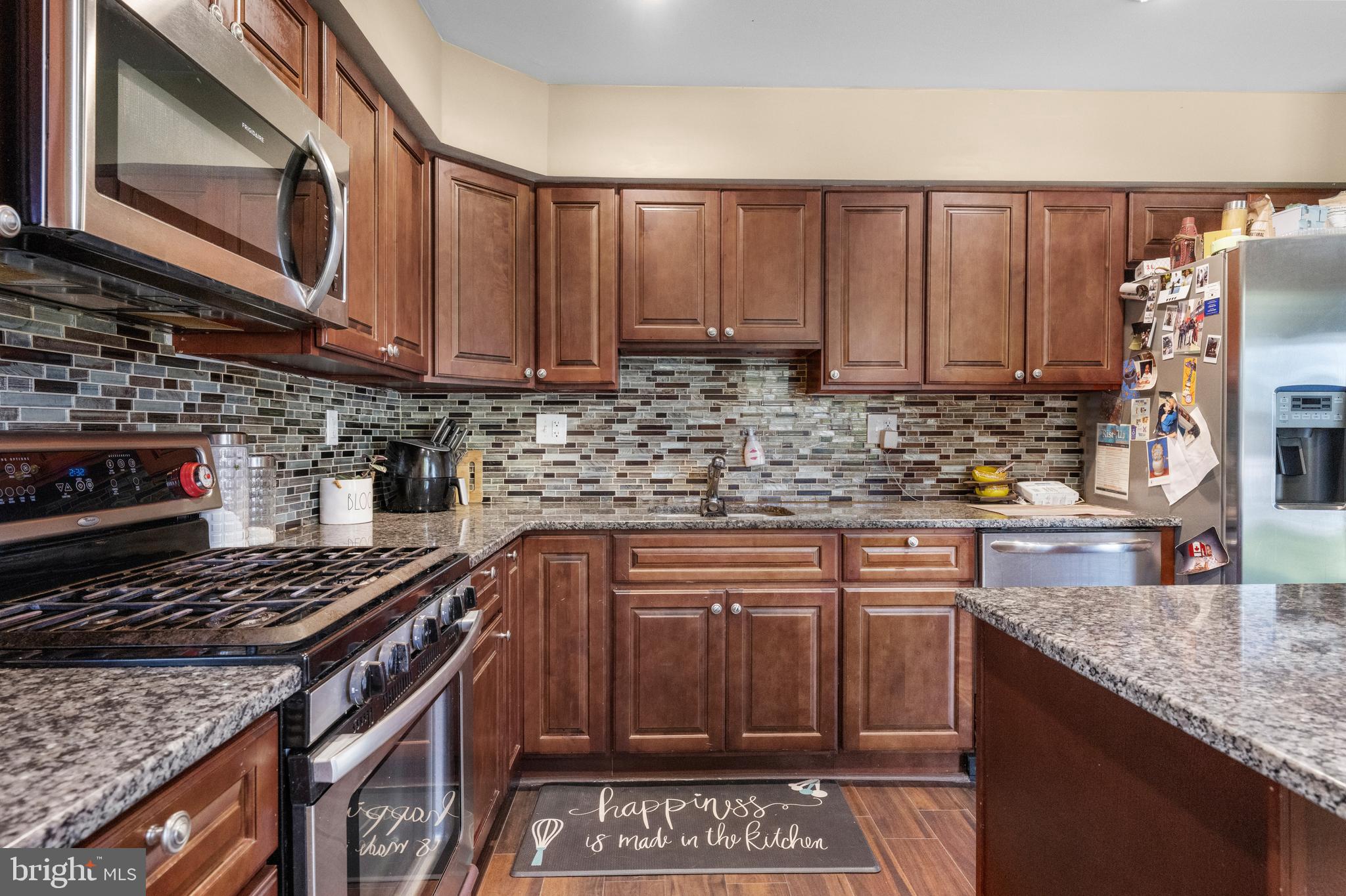 5 Fox Chase Drive Blackwood, NJ 08012 - Photo 12 of 23 a kitchen with stainless steel appliances granite countertop a stove a sink and a microwave