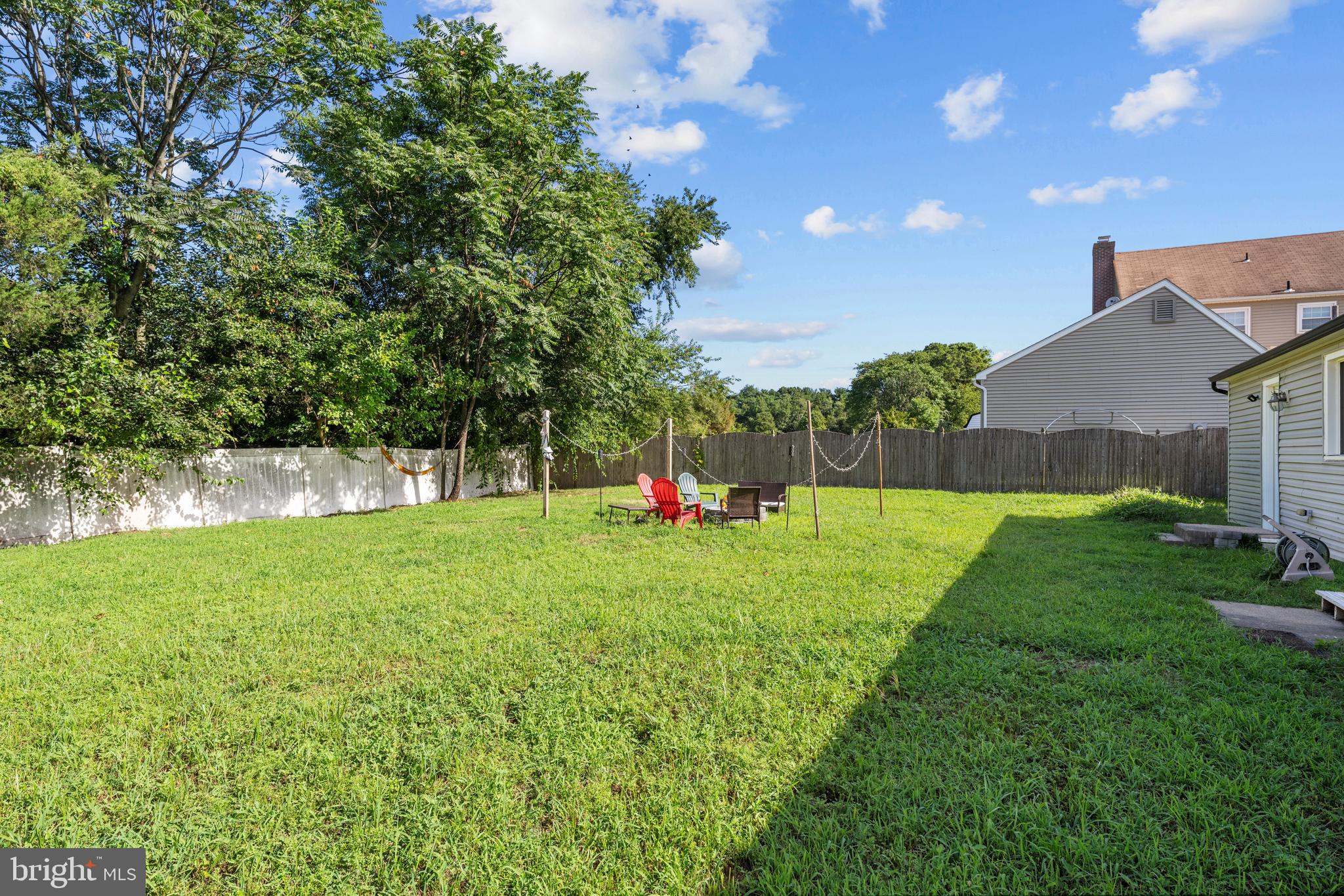 5 Fox Chase Drive Blackwood, NJ 08012 - Photo 21 of 23 a backyard of a house with table and chairs