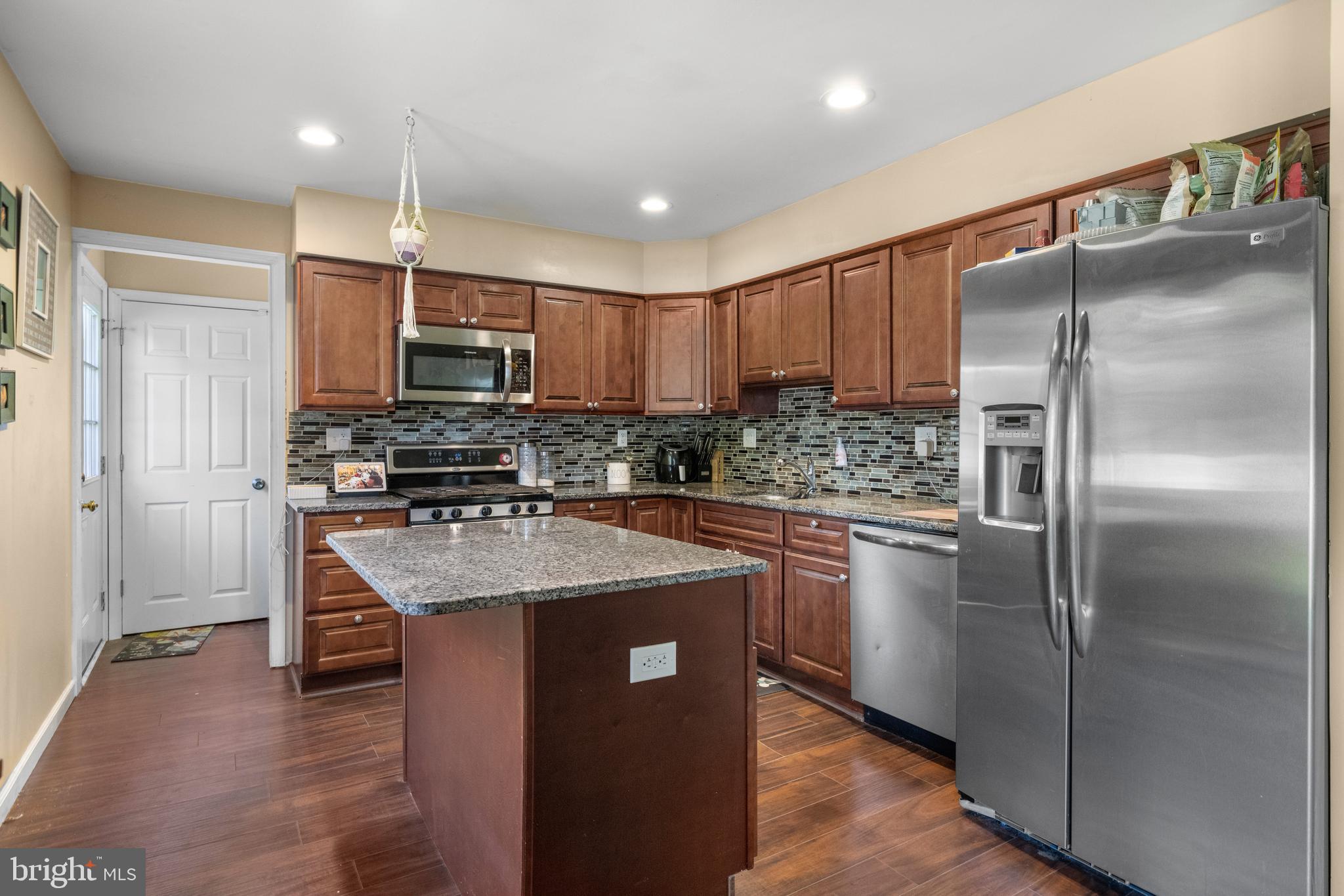 5 Fox Chase Drive Blackwood, NJ 08012 - Photo 10 of 23 a kitchen with kitchen island granite countertop stainless steel appliances cabinets a sink and a counter top space