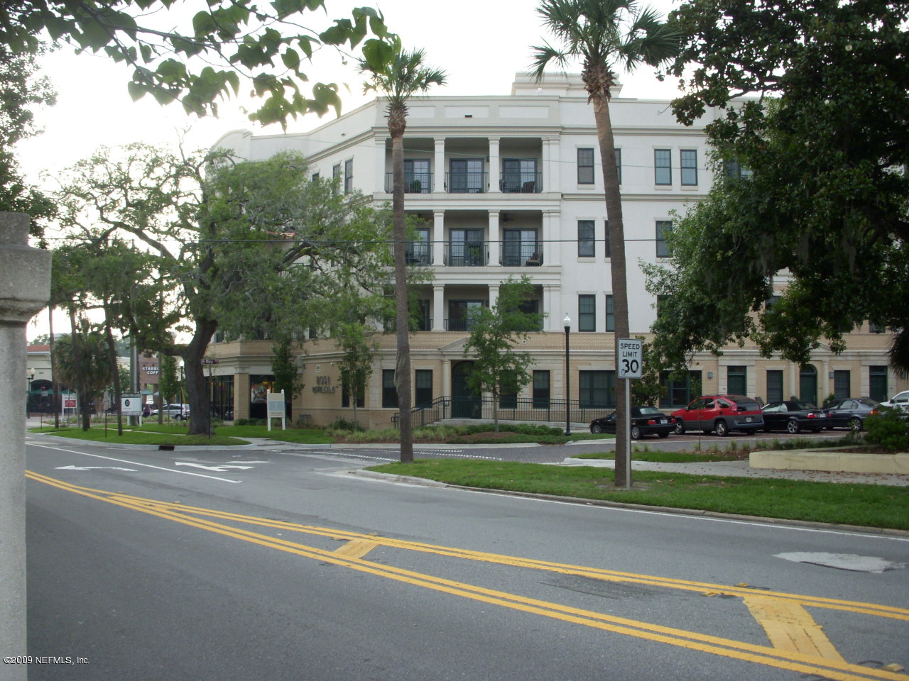 a view of a building with a yard